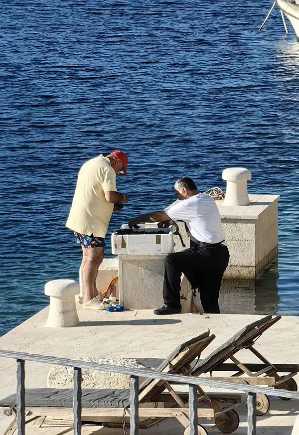 Man cleaning fresh seafood