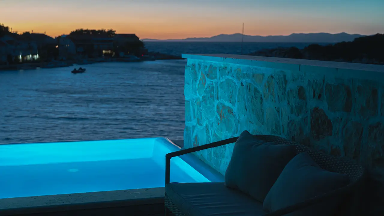 Private pool illuminated at night