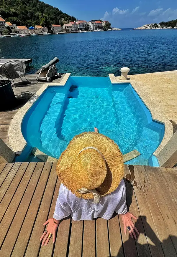 Woman relaxing by the pool